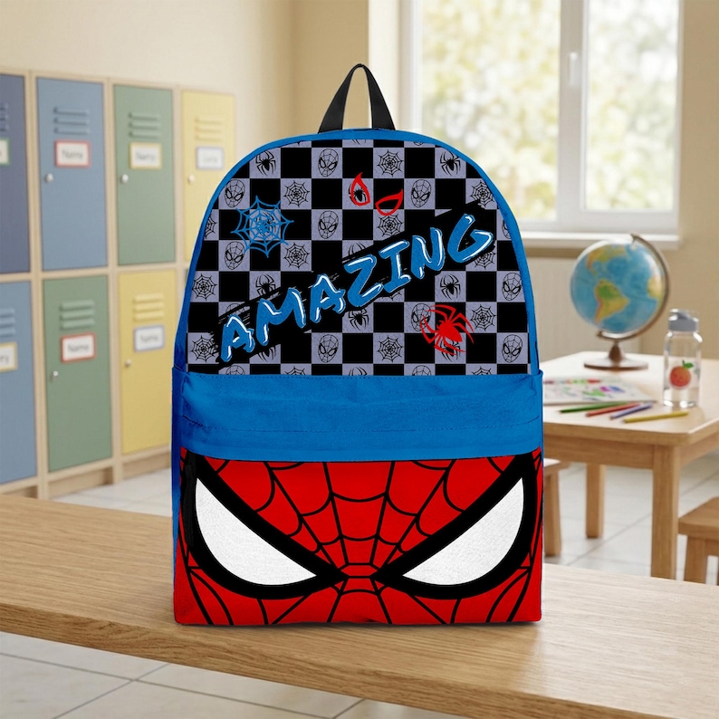 May include: A blue and red backpack featuring a Spider-Man design. The top section has a black and gray checkered pattern with spider webs and the word "AMAZING" in blue. The bottom section displays Spider-Man's eyes.