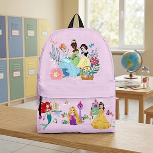 May include: A light purple backpack featuring a colorful illustration of animated princesses. The top section displays three princesses with flowers and a basket. The bottom section shows a mermaid, a princess with long hair, and a princess in a yellow dress.