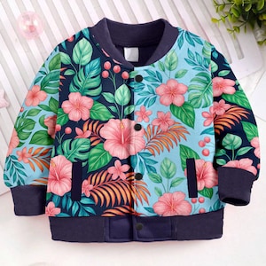 May include: A blue and floral bomber jacket with a tropical print. The jacket features a navy blue collar, cuffs, and pockets. The floral pattern includes pink hibiscus flowers, green leaves, and orange accents. The jacket has a button-up front.