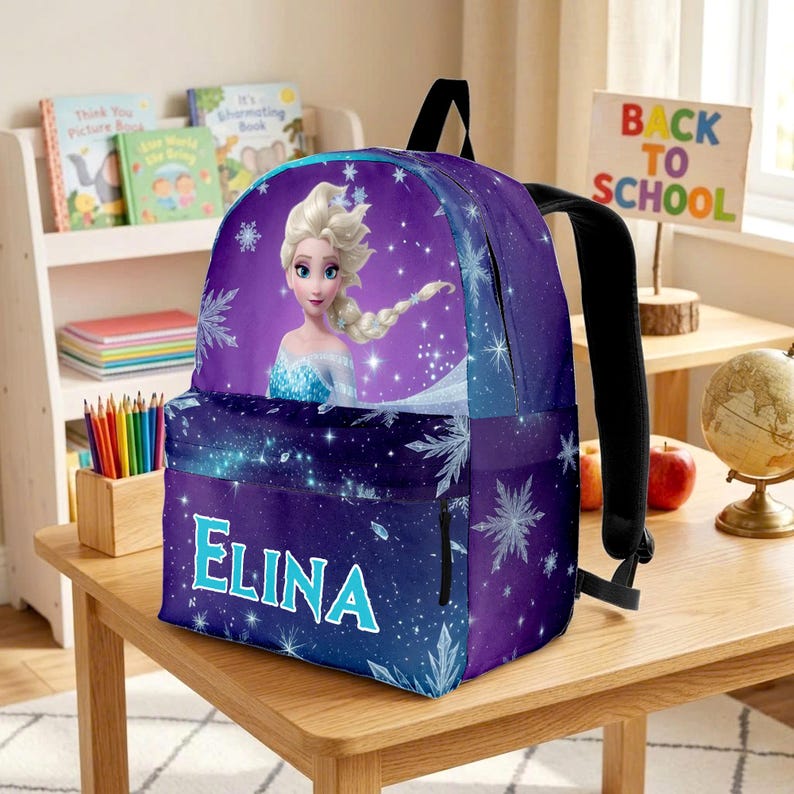 May include: A purple backpack featuring a graphic of Elsa from Frozen with a long blonde braid. The design includes white snowflake patterns and a starry background. The name ELINA is printed in large, light blue capital letters on the front pocket.