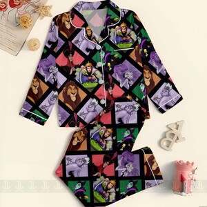 May include: A two-piece pajama set featuring a colorful diamond pattern with various Disney villains and characters. The long-sleeved top and shorts have white trim and buttons. The set includes characters like the Evil Queen, Ursula, and Scar.