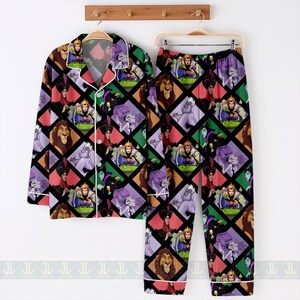 May include: A two-piece pajama set featuring a colorful pattern of Disney villains. The long-sleeved button-up shirt and matching pants display a repeating diamond pattern with characters like Ursula, Scar, and the Evil Queen. The pajamas have white trim.