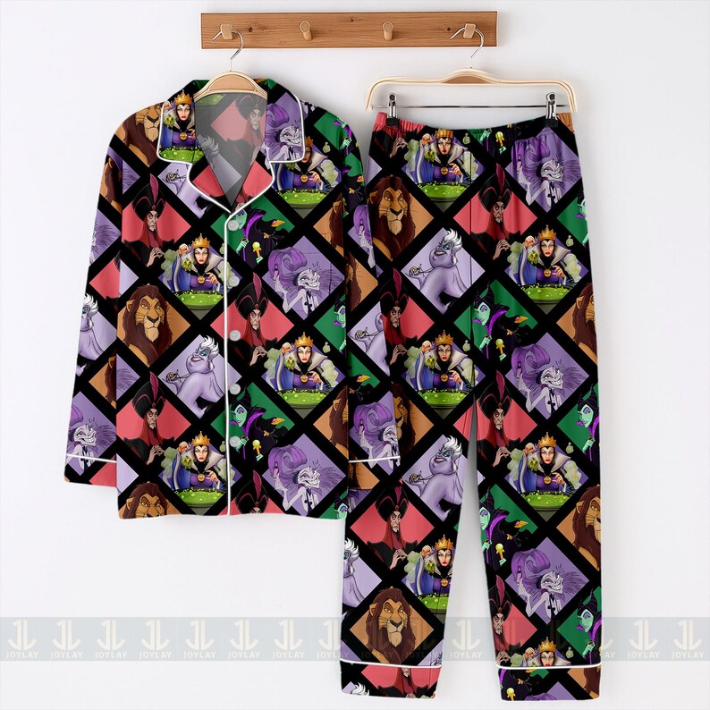 May include: A two-piece pajama set featuring a colorful pattern of Disney villains. The long-sleeved button-up shirt and matching pants display a repeating diamond pattern with characters like Ursula, Scar, and the Evil Queen. The pajamas have white trim.