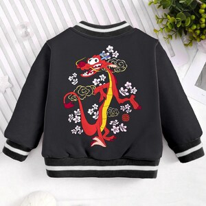 May include: Black bomber jacket with a red dragon design on the back. The dragon is surrounded by pink flowers and clouds. The jacket has white and black stripes on the cuffs and hem.