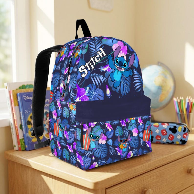 May include: A navy blue backpack featuring the character Stitch from Lilo & Stitch. The backpack has a tropical floral pattern with Stitch illustrations. The word "Stitch" is written in white on the front. The backpack has black straps.