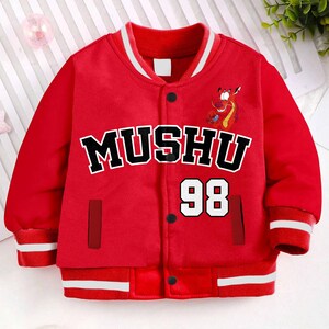 May include: A red varsity jacket with the word "MUSHU" in black block letters with a white outline, and the number "98" in white. The jacket has a cartoon dragon graphic and white stripes on the cuffs and collar.