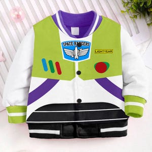 May include: A white, green, and purple bomber jacket with a black and white striped bottom. The jacket features a space ranger design with the text "Space Rangers" and "Lightyear" on the front.