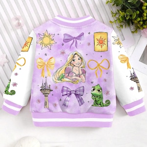 May include: Purple and white bomber jacket with a cartoon image of Rapunzel and Pascal from the Disney movie Tangled. The jacket has a variety of other images including suns, bows, and flowers.