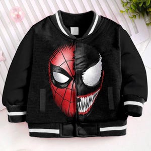 May include: Black bomber jacket with a white stripe on the collar and cuffs. The front of the jacket features a graphic of Spider-Man and Venom.