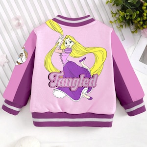 May include: A pink and purple children's jacket with a cartoon image of Rapunzel from the movie Tangled. The jacket has a purple collar and cuffs with white stripes. The text "Tangled" is printed on the jacket.