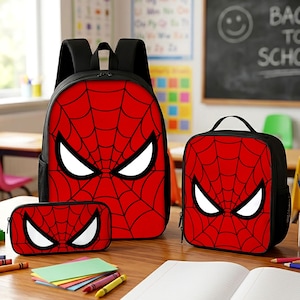 May include: A three-piece set consisting of a large backpack, a smaller lunch bag, and a pencil case. Each item is black with a vibrant red front panel featuring a black spiderweb pattern and large, white, almond-shaped eyes in the center.
