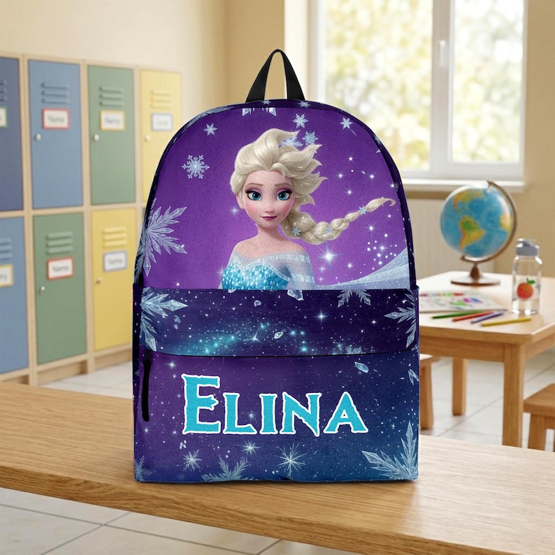 May include: A purple backpack featuring a graphic of a blonde character with a braided hairstyle, surrounded by white snowflake patterns and sparkling light effects. The name ELINA is printed in large, light blue capital letters on the front pocket.