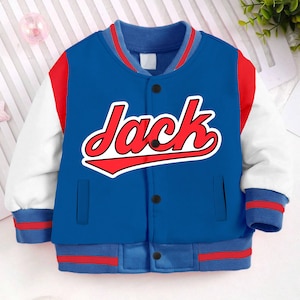 May include: Blue and white baseball jacket with red sleeves and red trim. The jacket has a red and white baseball-style graphic with the name "Jack" on the front.
