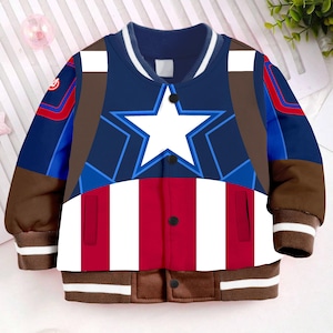 May include: A blue, red, and white bomber jacket with a large white star on the front. The jacket has brown trim and a zipper closure.