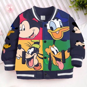 May include: A navy blue bomber jacket with a white stripe on the collar and cuffs. The jacket features a colorful patchwork design with images of Mickey Mouse, Donald Duck, and Goofy.