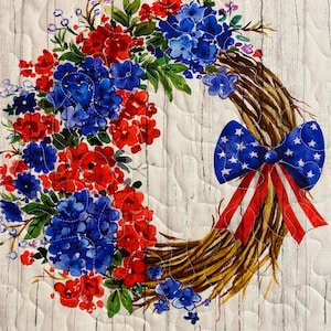May include: A patriotic wreath design featuring red and blue flowers, a bow with stars, and red and white striped ribbons. The wreath is set against a white, wood-grain background with a blue and red plaid border.