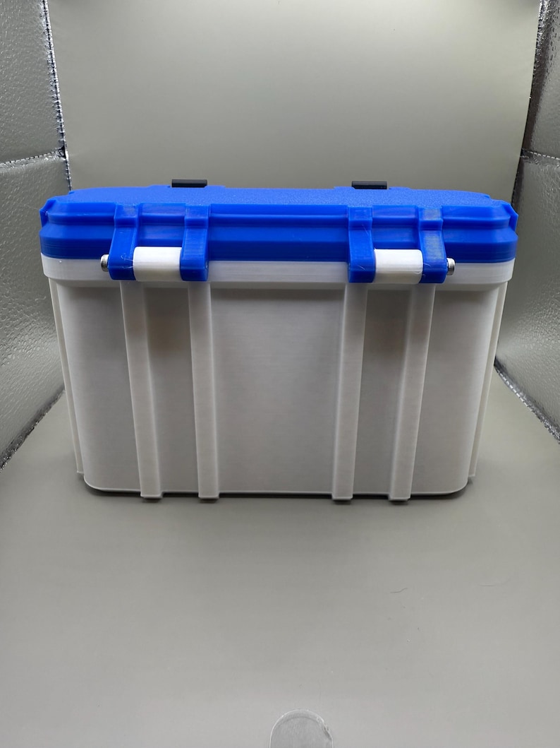 May include: A white and blue plastic storage container with a latching lid. The container is rectangular in shape and made from durable plastic.