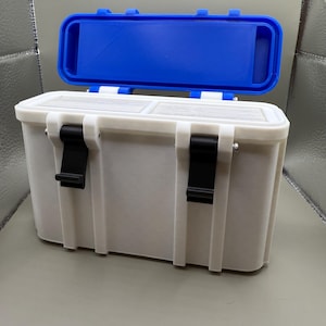 May include: A white plastic storage box with a blue lid. The box has two black latches on each side and a white interior.