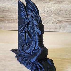 Black Majestic Dragon Bookend with on wooden tabletop