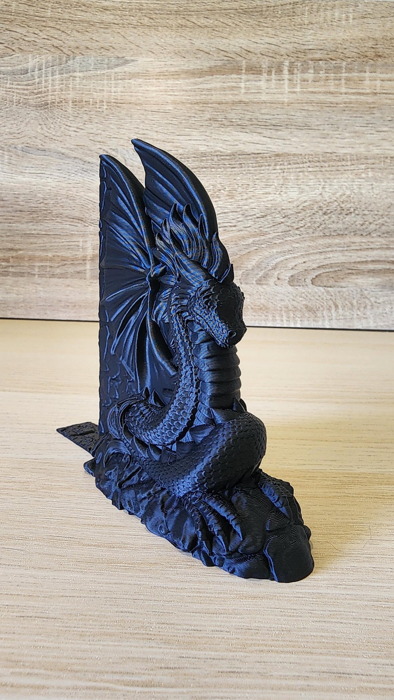 Black Majestic Dragon Bookend with on wooden tabletop