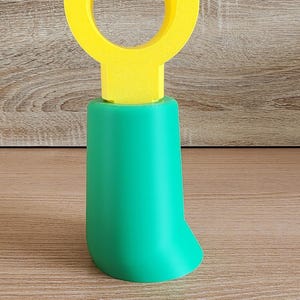 Green Minifig-Inspired Controller Stand on wooden background