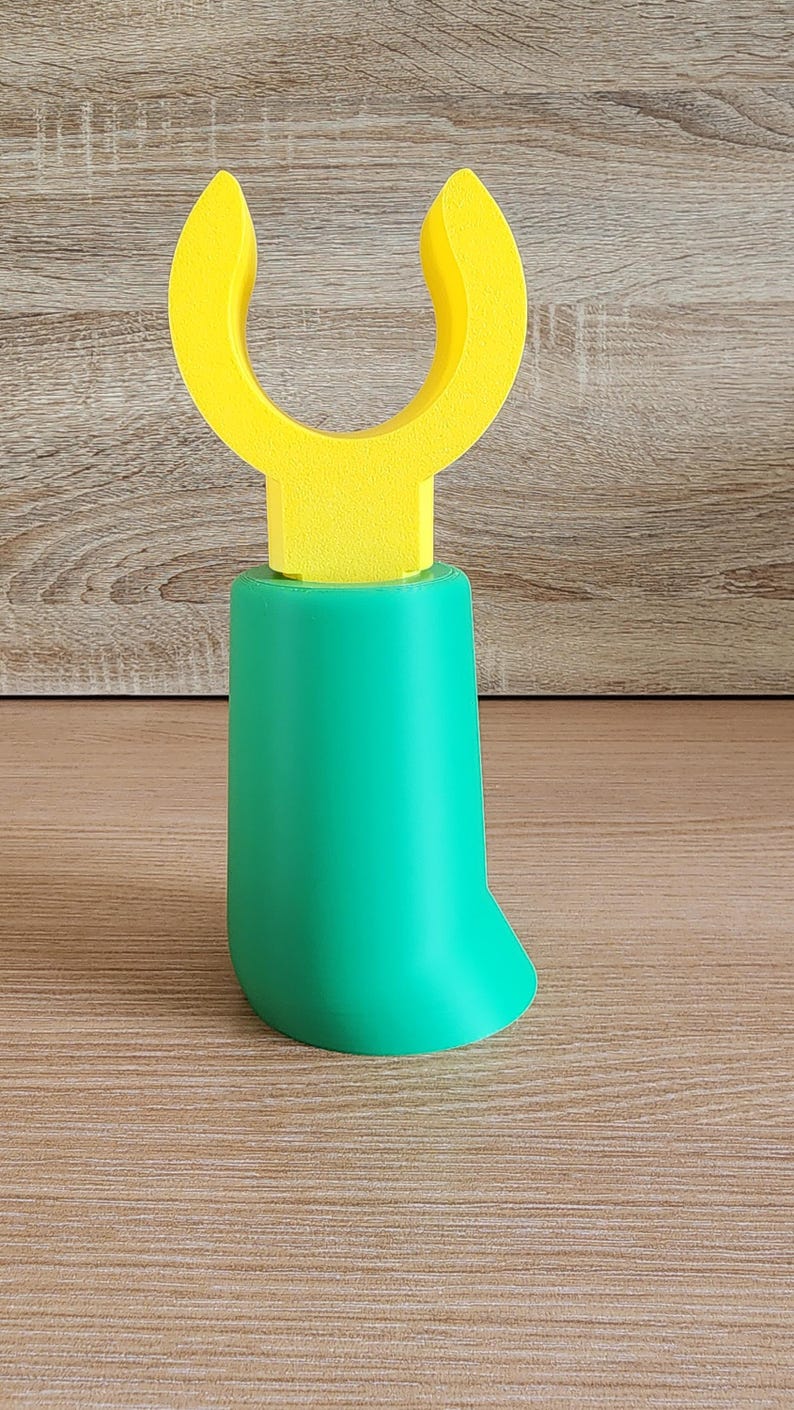 Green Minifig-Inspired Controller Stand on wooden background