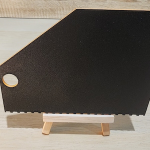 Black and orrange brick ruler showing the back view.