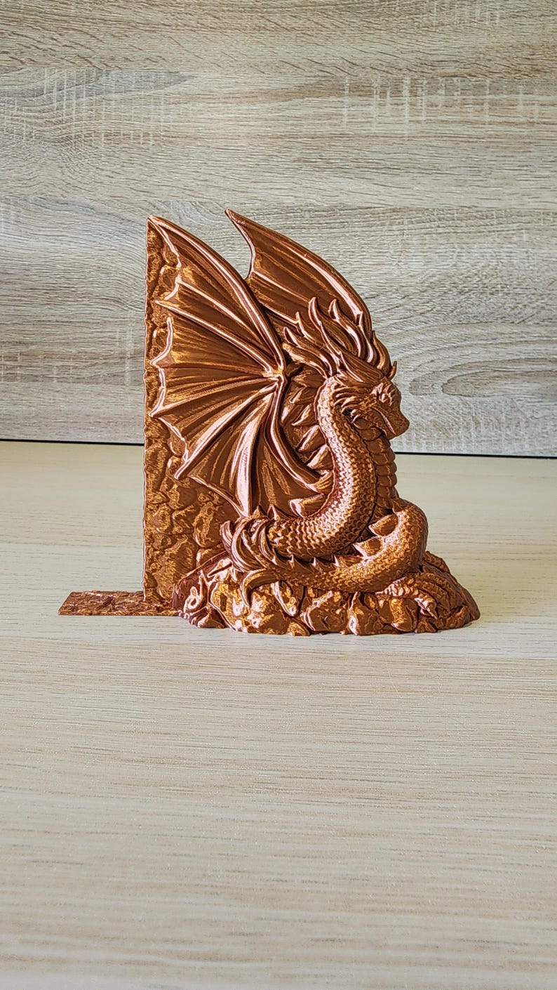 Copper dragon bookend angled to show wing and head detail