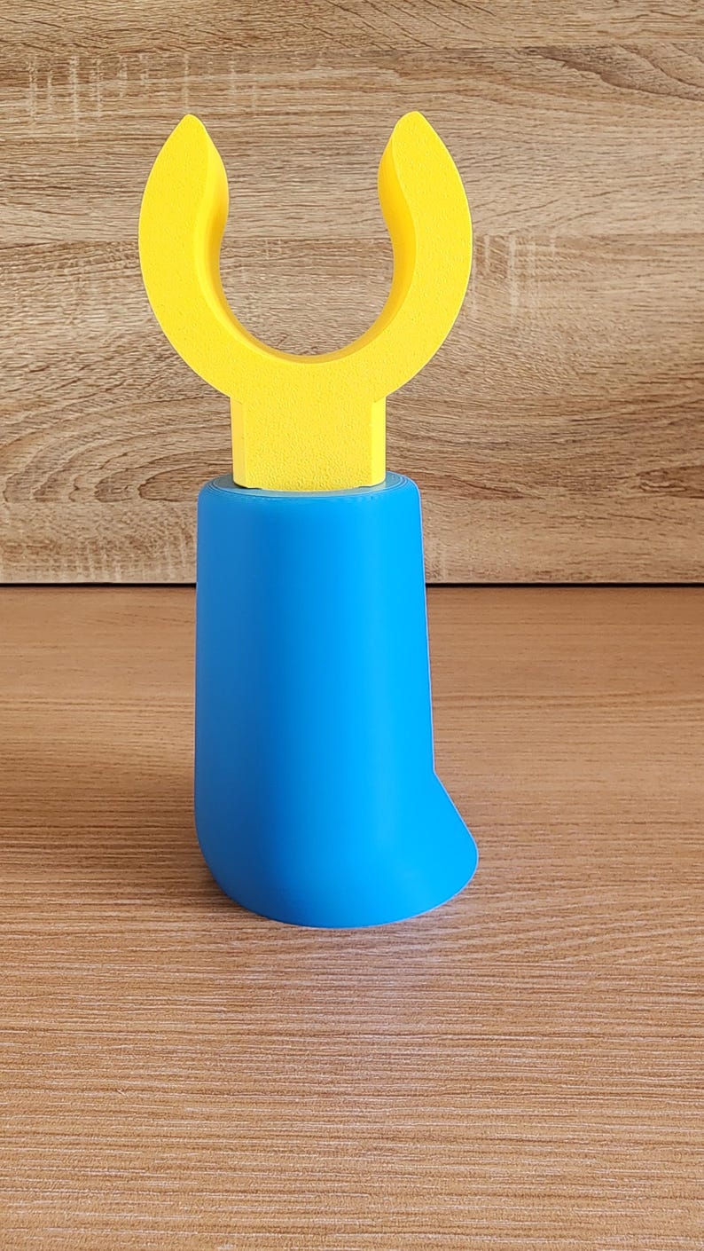 Blue Minifig-Inspired Controller Stand shown upright on wooden surface