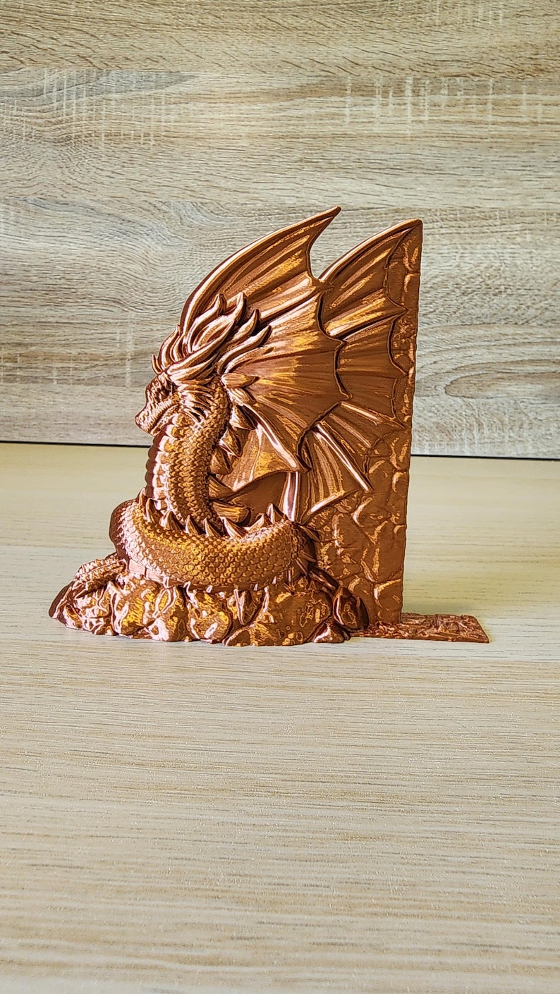 Copper dragon bookend angled to show wing and head detail