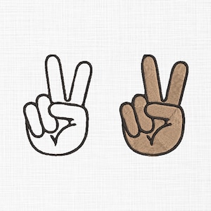 May include: Two embroidered peace sign hand gestures. One is an outline in black thread, the other is filled in with tan thread and outlined in brown. Both are on a white textured background.