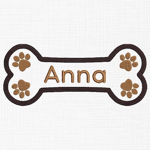May include: Brown dog bone with paw prints and the name "Anna" embroidered in white.