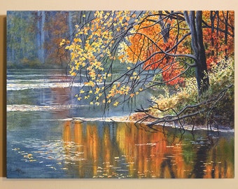 May include: A rectangular painting depicting a tranquil lake scene during autumn. The composition features dark tree trunks and branches with vibrant yellow and orange foliage overhanging the water, creating a reflection on the surface.