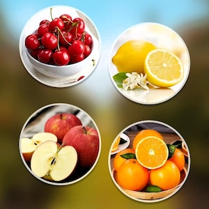 May include: A bowl of red cherries, a lemon, a whole orange and two halves of oranges, and two red apples, one whole and one cut in half.