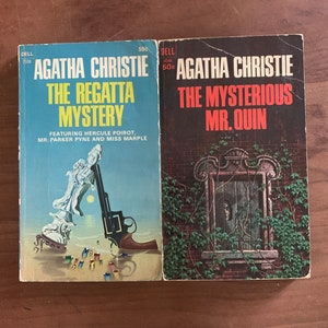May include: Two paperback mystery novels by Agatha Christie. The first book is "The Regatta Mystery" featuring Hercule Poirot, Mr. Parker Pyne and Miss Marple. The second book is "The Mysterious Mr. Quin".