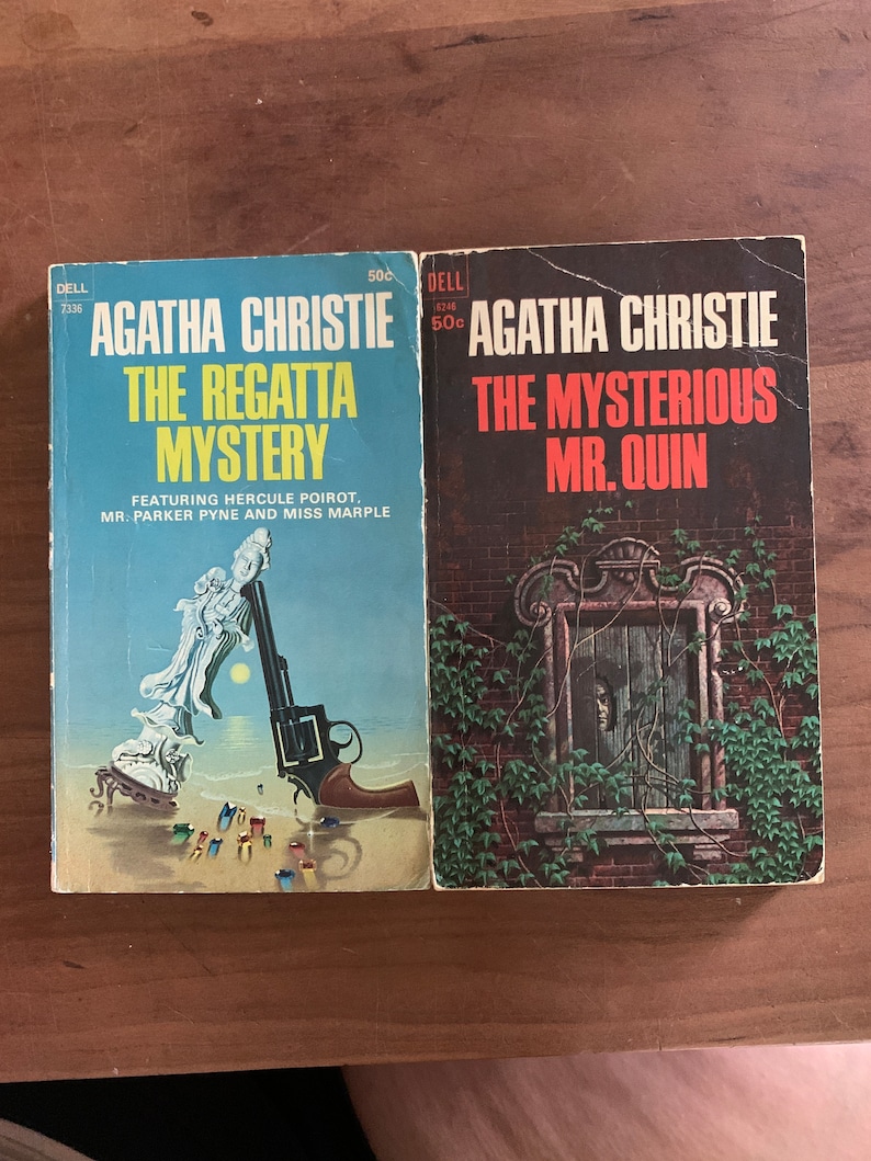 May include: Two paperback mystery novels by Agatha Christie. The first book is "The Regatta Mystery" featuring Hercule Poirot, Mr. Parker Pyne and Miss Marple. The second book is "The Mysterious Mr. Quin".