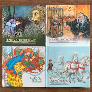 May include: Four illustrated children's books with colorful covers. The books are titled "Beauty and the Beast", "Hansel and Gretel", "Sleeping Beauty", and "The Snow Queen".