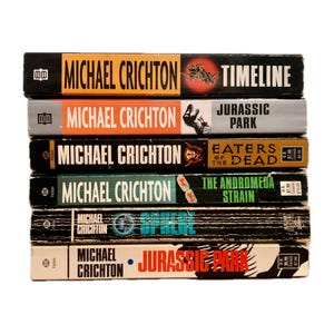 Sold separately , Michael Crichton books, Jurassic park, timeline , Eaters of the dead, the andromeda strain, sphere,