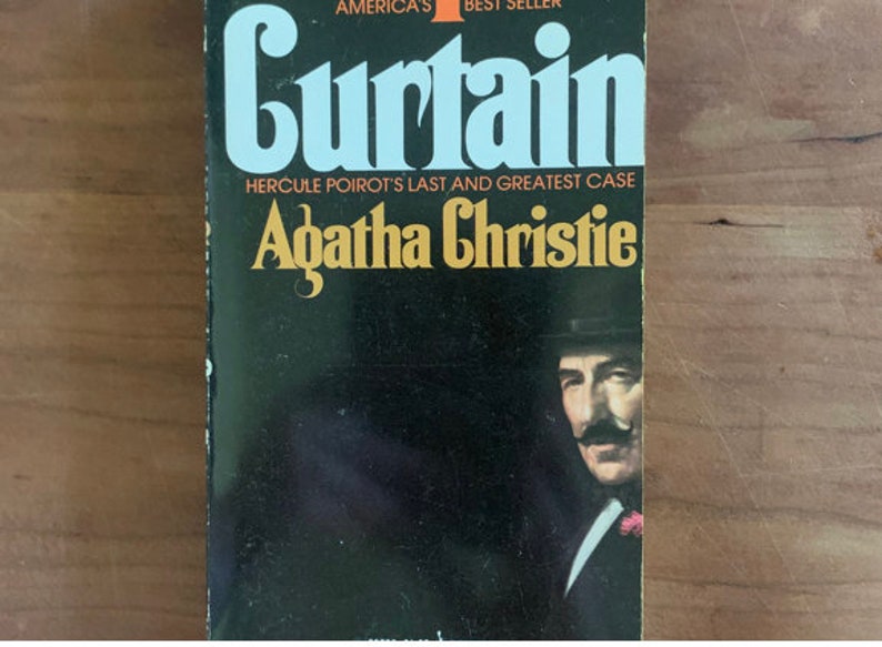 May include: A black and white book cover with the title "Curtain" in large white letters. The book is by Agatha Christie and features the text "Hercule Poirot's Last and Greatest Case". A black and white photo of a man with a mustache is in the bottom right corner.