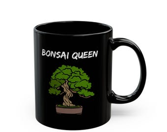 May include: Black ceramic mug with a white inscription "Bonsai Queen" and a green bonsai tree illustration.