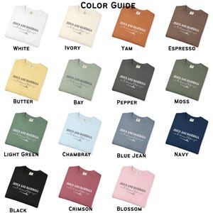 May include: A color guide featuring various t-shirts in different colors, each displaying the text "JESUS AND BASEBALL can the boys get before you". Colors include white, ivory, yam, espresso, butter, bay, pepper, moss, light green, chambray, blue jean, navy, black, crimson, and blossom.