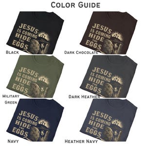 May include: A color guide displays six t-shirts in various colors: black, dark chocolate, military green, dark heather, navy, and heather navy. Each shirt features the text "JESUS IS COMING HIDE THE EGGS" with a graphic of Jesus and Easter eggs.