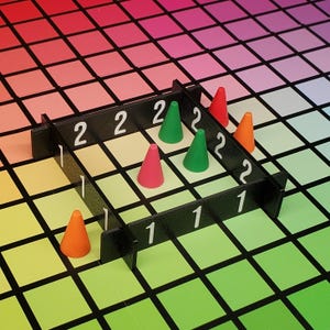 May include: A black board game with white numbers and colourful cone-shaped pieces. The game board is set against a gradient background of squares in various colours, including red, green, and yellow. The game pieces are red, green, and orange.