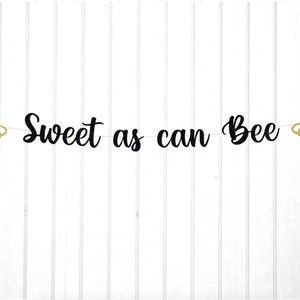 May include: Black and gold glitter banner with the text "Sweet as can Bee" and two bee silhouettes on either end.