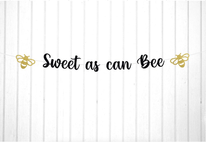 May include: Black and gold glitter banner with the text "Sweet as can Bee" and two bee silhouettes on either end.