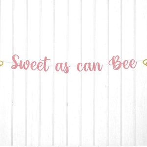 May include: Pink glitter banner with the text "Sweet as can Bee" and two gold glitter bee cutouts.