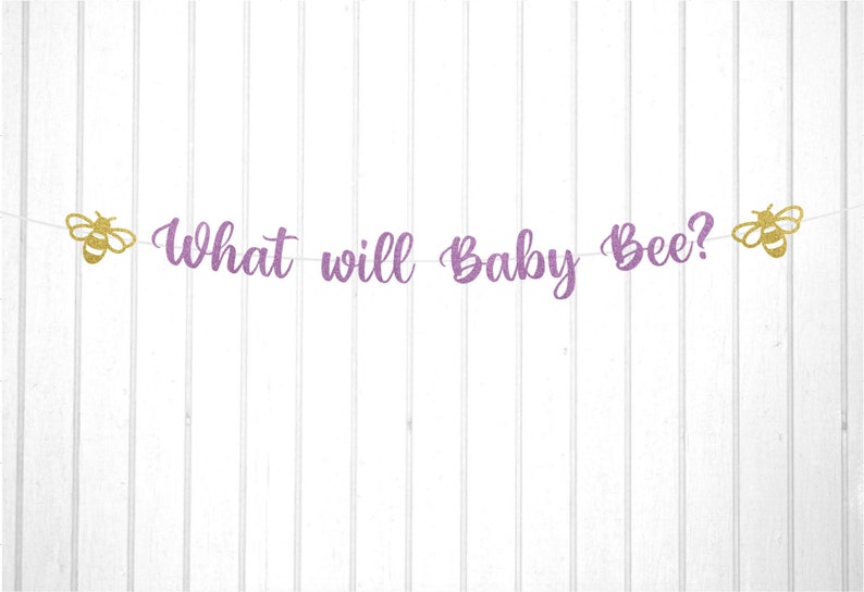 May include: Purple glitter banner with the text "What will Baby Bee?" and two gold glitter bee cutouts.