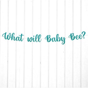May include: Teal and gold glitter banner with the text "What will Baby Bee?" and two gold glitter bee cutouts.