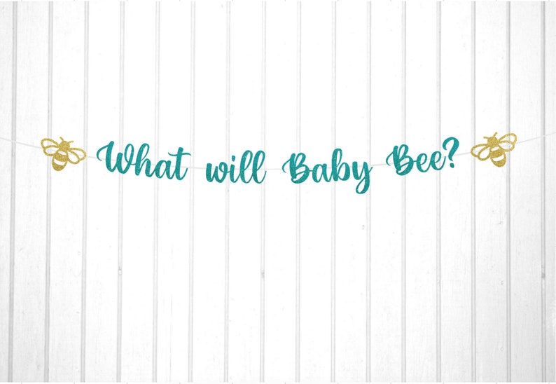 May include: Teal and gold glitter banner with the text "What will Baby Bee?" and two gold glitter bee cutouts.