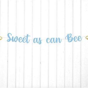May include: A blue and gold glitter banner with the text "Sweet as can Bee" and two gold glitter bee cutouts.